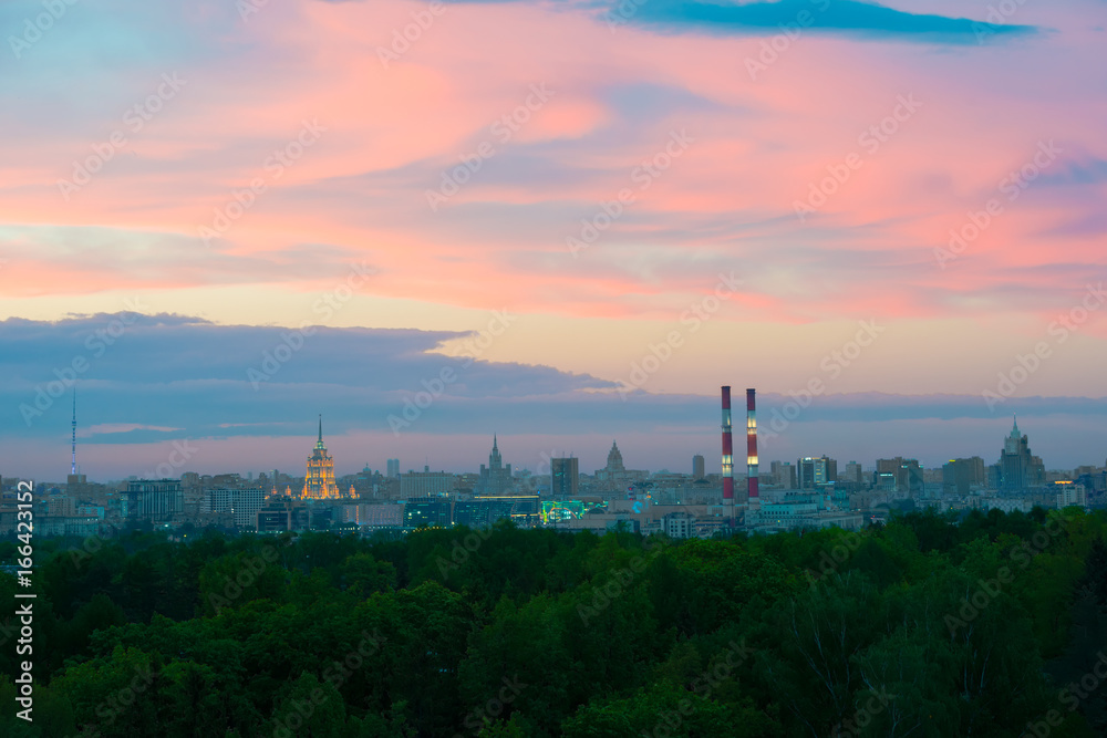 The buildings of Moscow city center at sunset time. Industrial metropolis. The clouds painted by sunset above Moscow,evening in Russia.