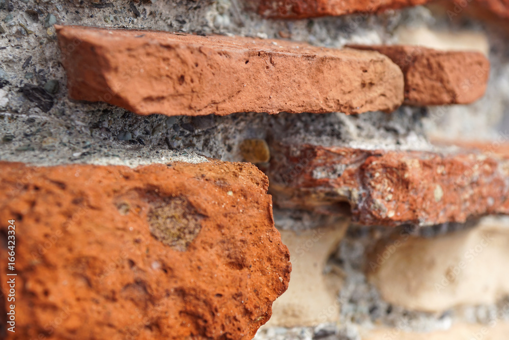 Closeup of Stack of Raw Bricks on the external wall Closeup of Stack of Raw Bricks on the external wall