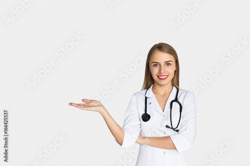 Woman in whites holding hand palm up