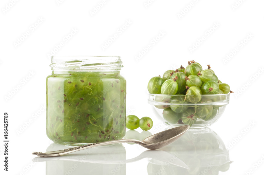 Gooseberry smoothie in a jar on a white table. Isolated Gooseberry smoothie in a jar on a white table. Isolated