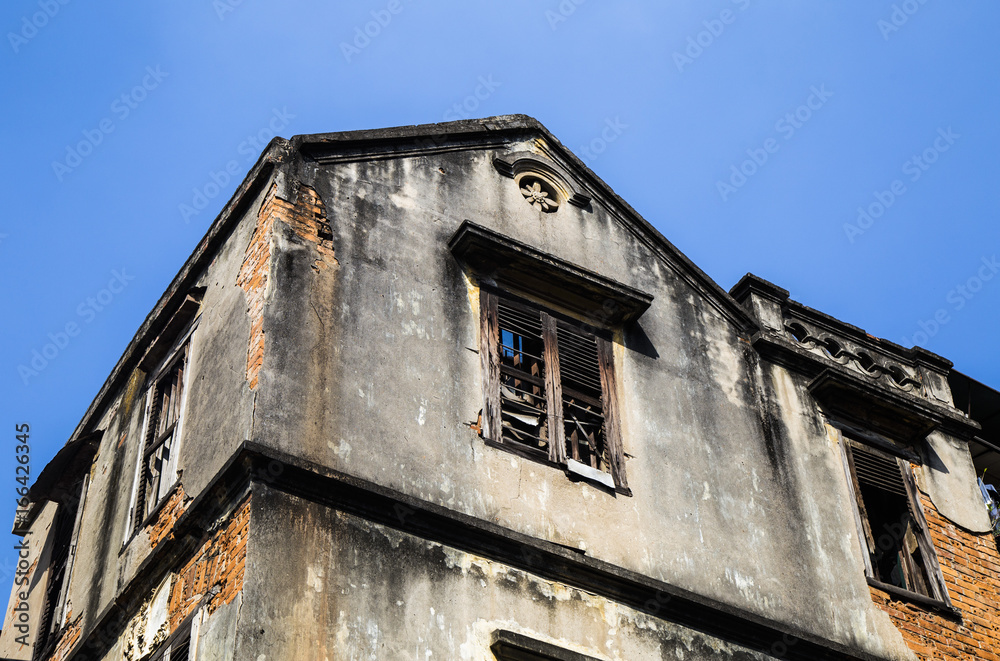 Close up of an old damaged French architectural house in Hanoi capital, Vietnam Close up of an old damaged French architectural house in Hanoi capital, Vietnam