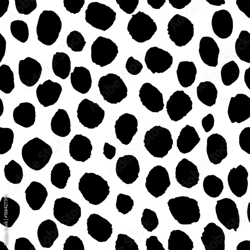 Black hand painted dots on white background. Stylish minimalist seamless vector pattern