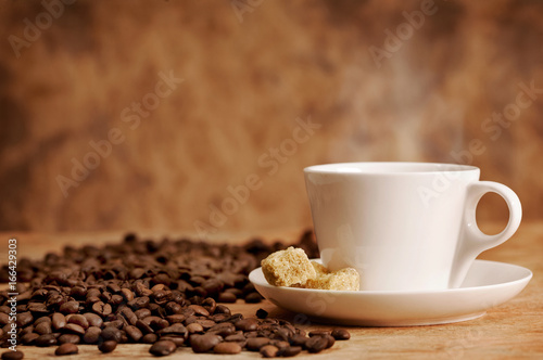 coffee cup with sugar and coffee beans