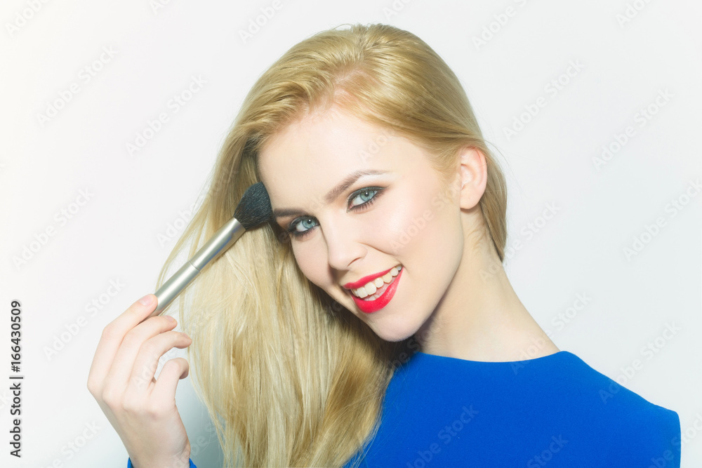 Happy girl with blond long hair smiling with red lips Happy girl with blond long hair smiling with red lips