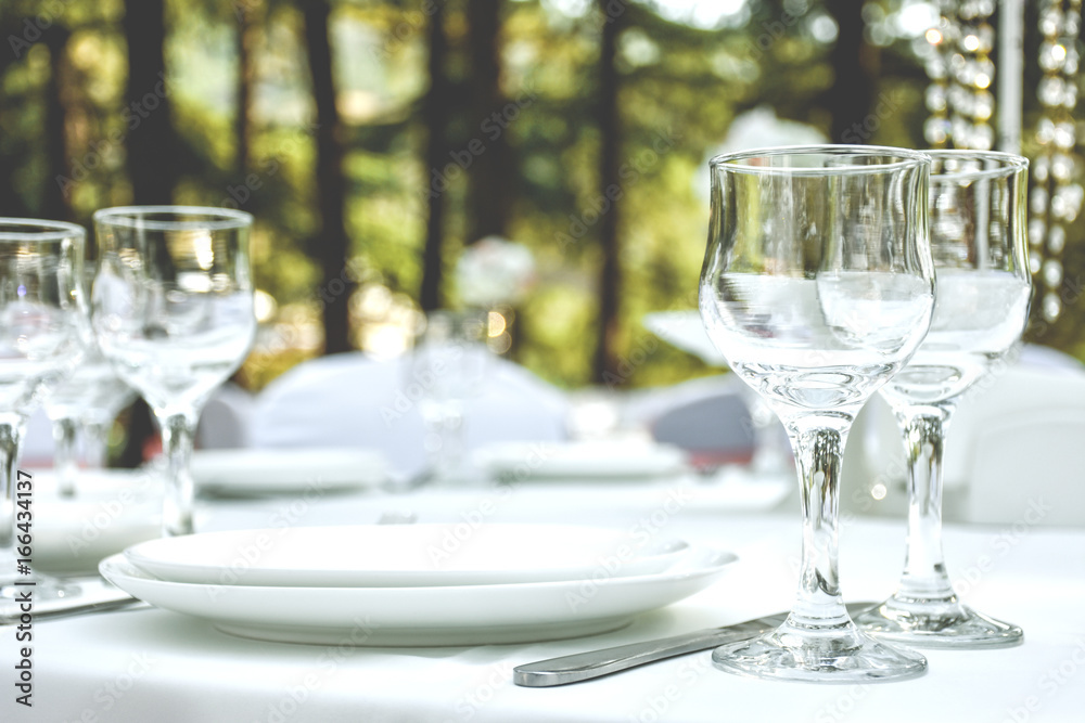 Tableware - cutlery and white plates. Tableware - cutlery and white plates.
