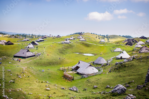 Velika planina plateau, Slovenia, Mountain village in Alps, wooden houses in traditional style, popular hiking destination photo
