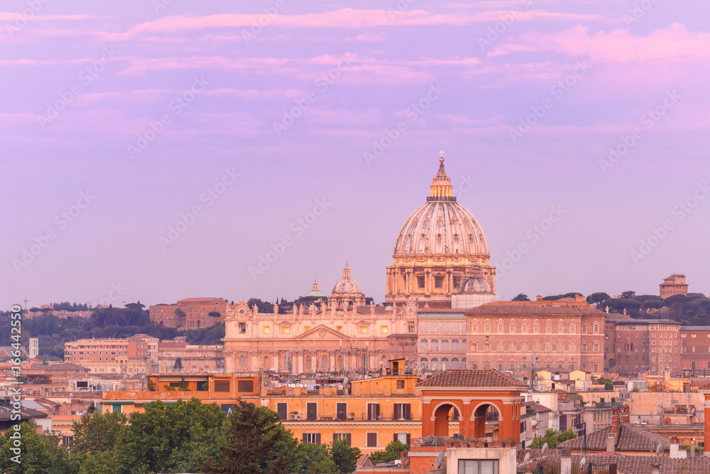 The view from the Pincian Hill overlooking St. Peter Basilica during beautiful sunset in Rome, Italy.