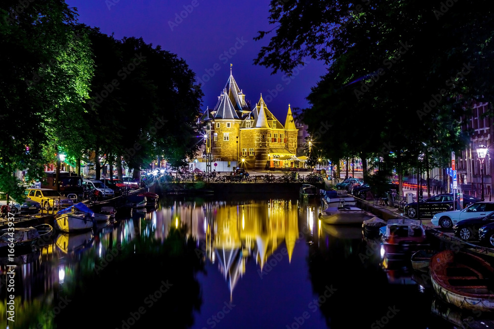 Amsterdam castle and reflection in front of canal