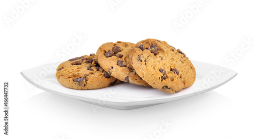 Chocolate chip cookie in ceramic white plate on white background