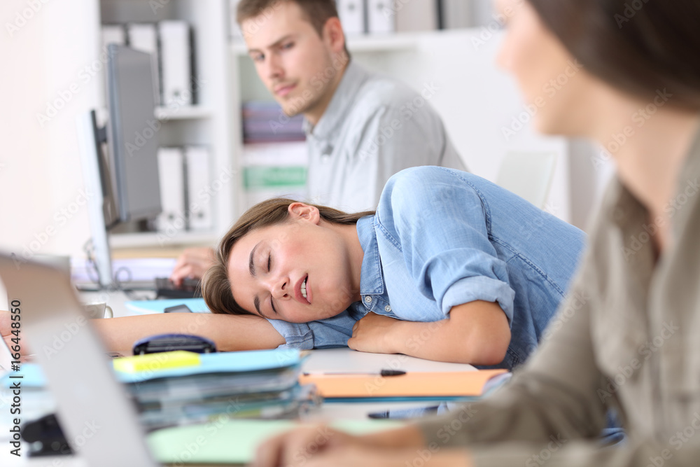 Fatigued employee sleeping at office - obrazy, fototapety, plakaty 