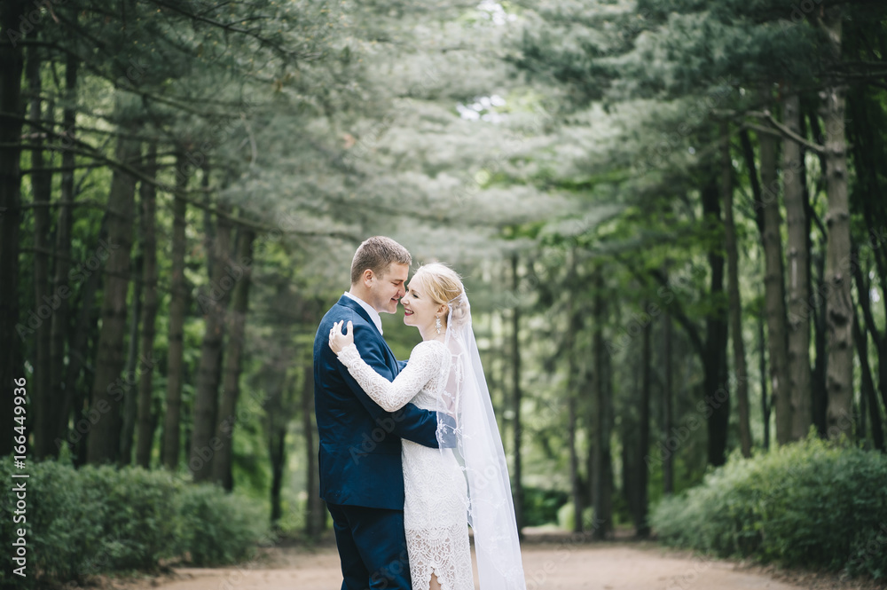 Beautiful married young happy couple dancing in the forest all alone Beautiful married young happy couple dancing in the forest all alone