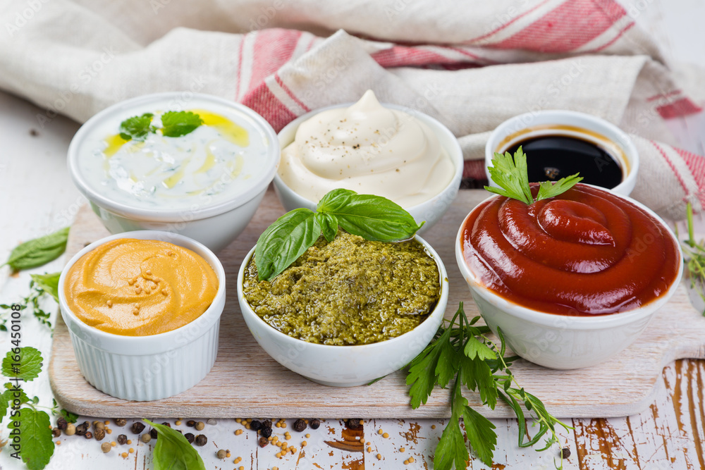 Selection of different sauces in bowls Selection of different sauces in bowls