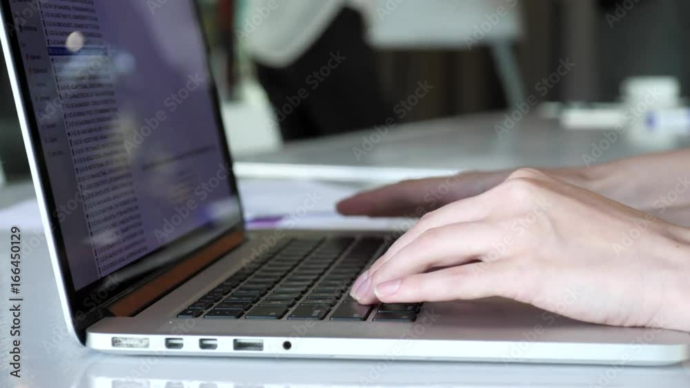 Close-up of hands. Office worker, woman typing on computer Close-up of hands. Office worker, woman typing on computer