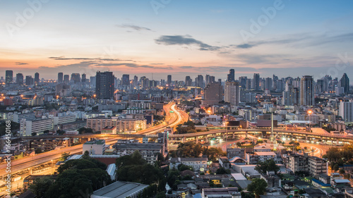 Bangkok City at sunrise time, Hotel and resident area in the capital of Thailand.Top view : modern building in Business bangkok district at Bangkok city with skyline at twilight,Thailand © MemoryMan