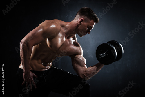 Athletic male with dumbbells © Maksim Toome