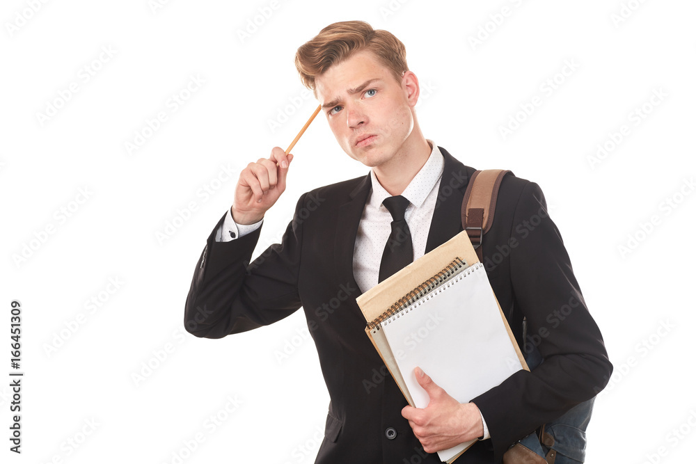 Studio portrait of teenage college student in black suit posing against white background Studio portrait of teenage college student in black suit posing against white background