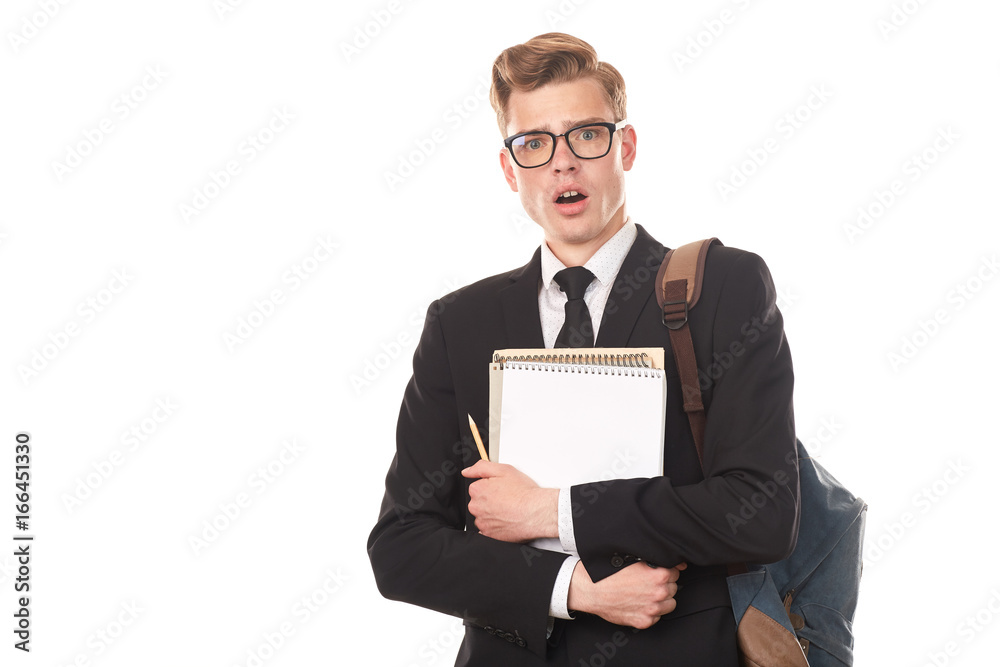 Studio portrait of teenage college student in black suit posing against white background Studio portrait of teenage college student in black suit posing against white background