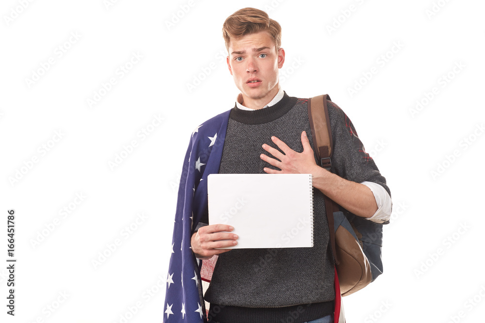 Portrait of male university student with American flag over his shoulders Portrait of male university student with American flag over his shoulders