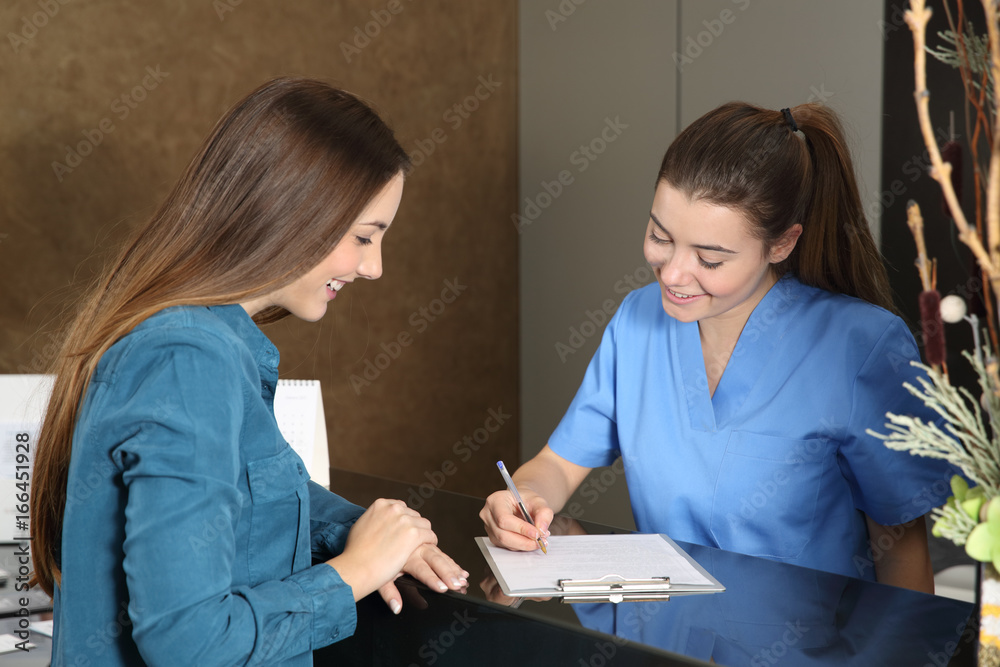 Nurse or dentist attending a client Nurse or dentist attending a client