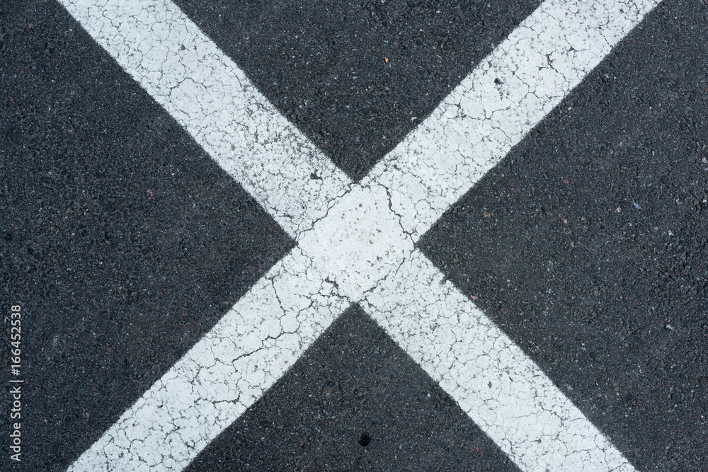 top view of white parking lines on grey roadway background