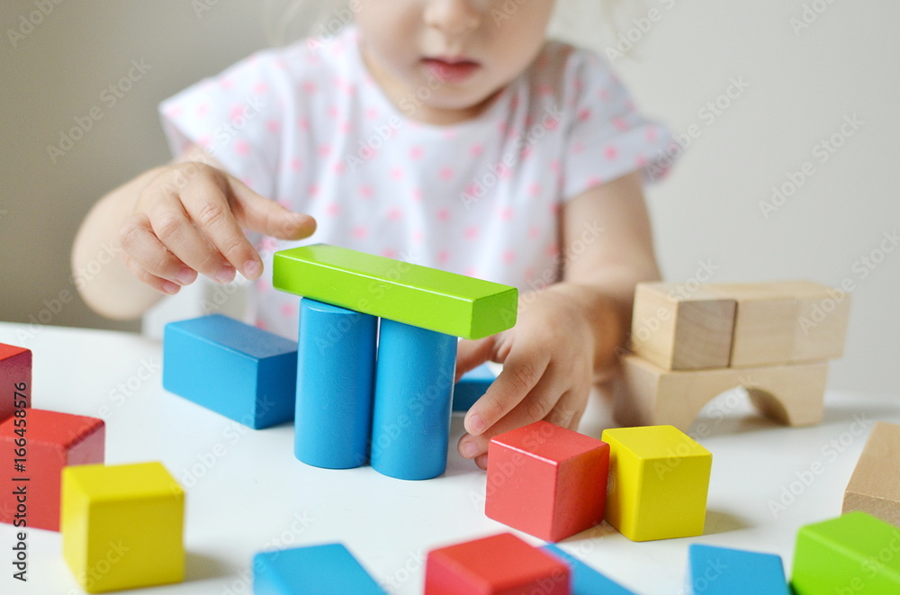 Caucasian Girl Playing with Wooden Colorful Cubes at Home Early Education Preparing for School Development Caucasian Girl Playing with Wooden Colorful Cubes at Home Early Education Preparing for School Development