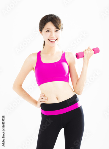 happy fitness woman working out with dumbbells.