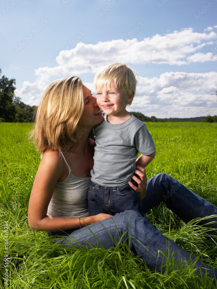 Fototapeta premium Mother and son playing in a field