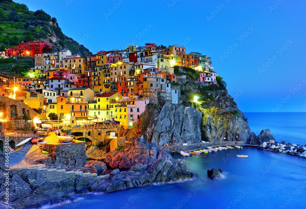 Manarola village along the coastline of Cinque Terre area at night in Italy.