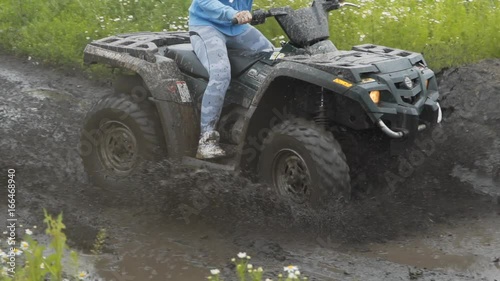 A trip on an ATV for off-road and dirt. Driving POV on an ATV on a rural wilderness road through a forest