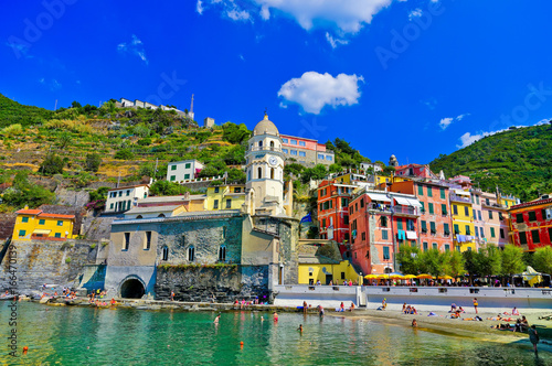 View of the beautiful seaside of Vernazza village in summer in the Cinque Terre area, Italy. photo