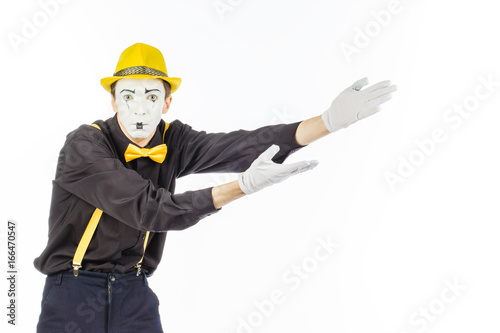 Portrait of a man, an artist, a pantomime. Shows something, isolated on white background