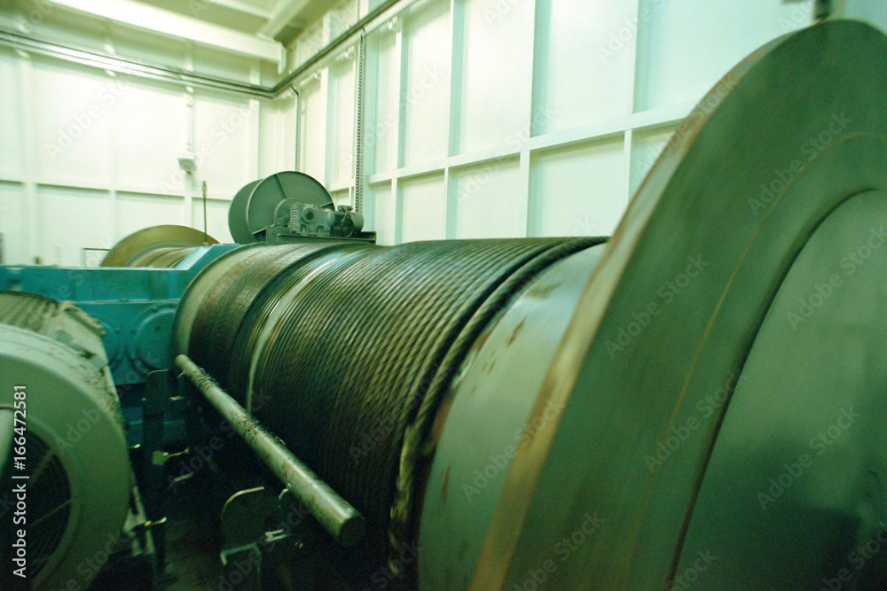 Winding drum with coiled cable in an engine room Winding drum with coiled cable in an engine room