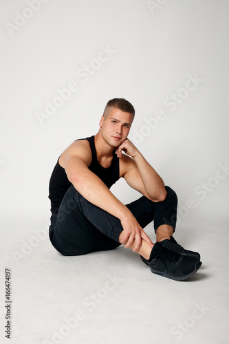 Expressive young stylish man in black t-shirt