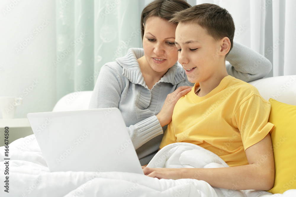 Mother and son using laptop Mother and son using laptop