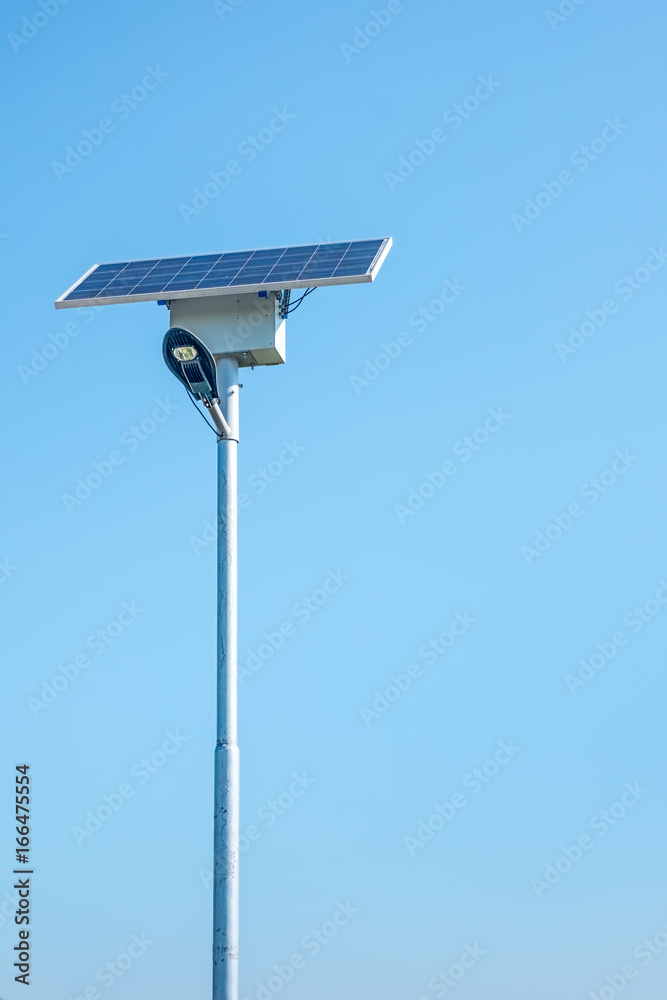 LED street light with solar cell on clear sky, closeup view. LED street light with solar cell on clear sky, closeup view.