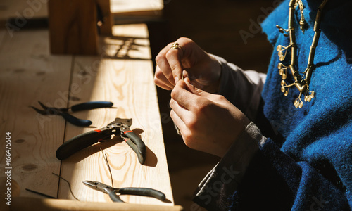 Obraz na płótnie Female craftsman hands working with jewellery, selective focus w salonie