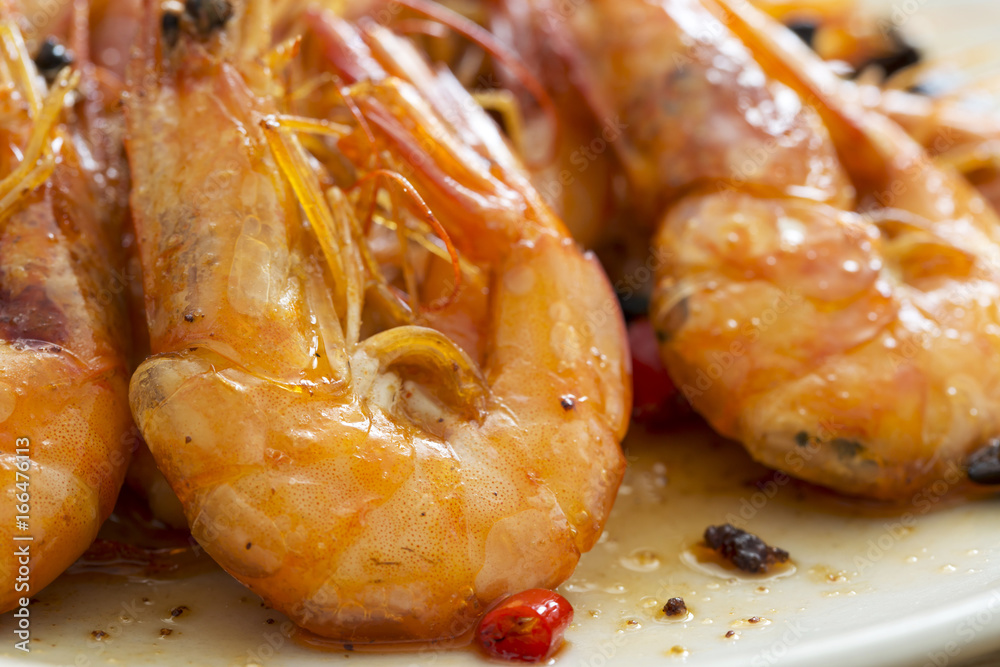 Delicious seafood shrimp closeup on a plate. Delicious seafood shrimp closeup on a plate.