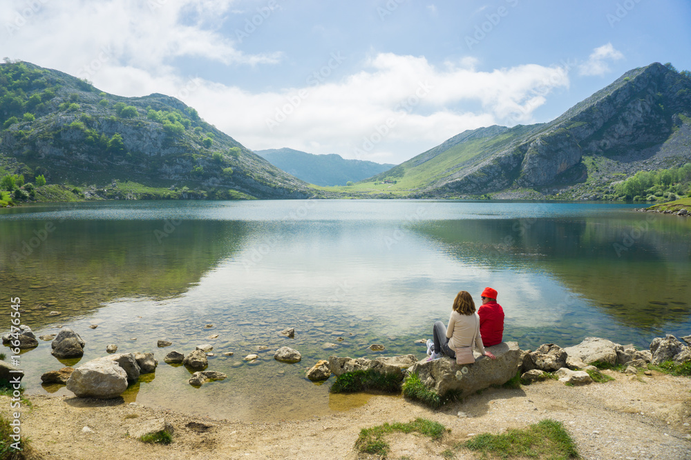 Beautiful nature of Spain: Covadonga mountain lakes in summer sunny day with blue sky and clouds Beautiful nature of Spain: Covadonga mountain lakes in summer sunny day with blue sky and clouds
