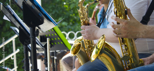 Street musician plays his saxophone
