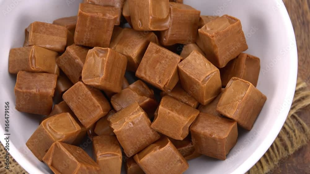 Caramel on a rotating wooden plate (seamless loopable; 4K) Caramel on a rotating wooden plate (seamless loopable; 4K)