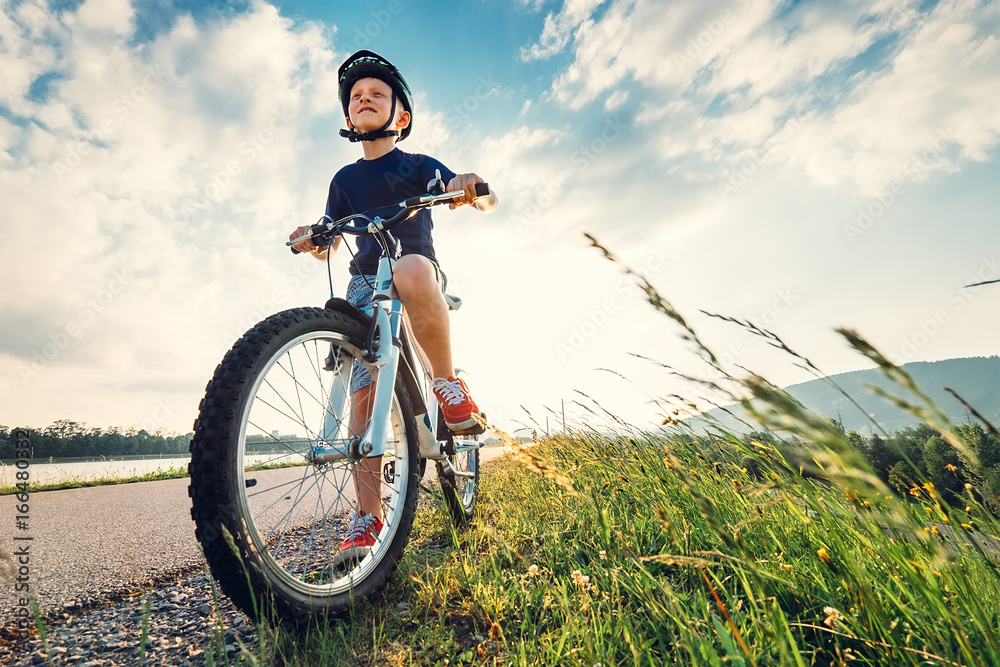 Fototapeta premium Boy start to ride a bicycle