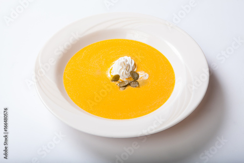 Pumpkin Soup with whipped cream and pumpkin seeds