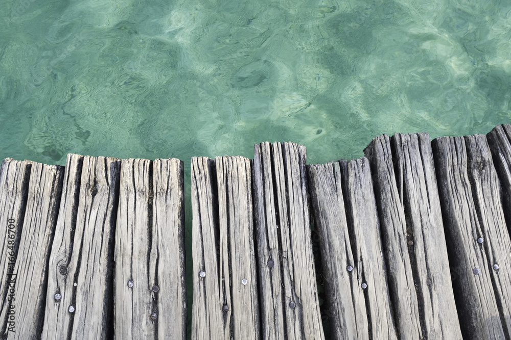 Wooden platform above clear turquoise water