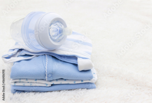 Baby clothes for newborn and pacifier , In blue colors. photo