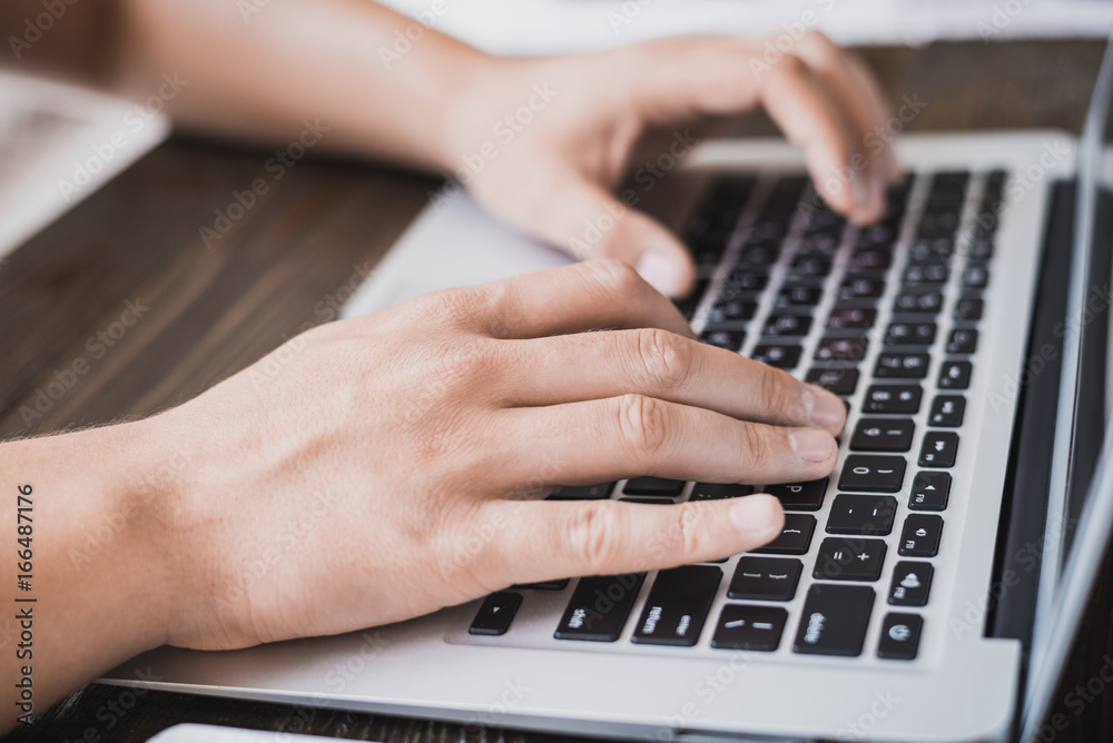 Morning business male. Male hands working on a laptop. Horizontal frame Morning business male. Male hands working on a laptop. Horizontal frame