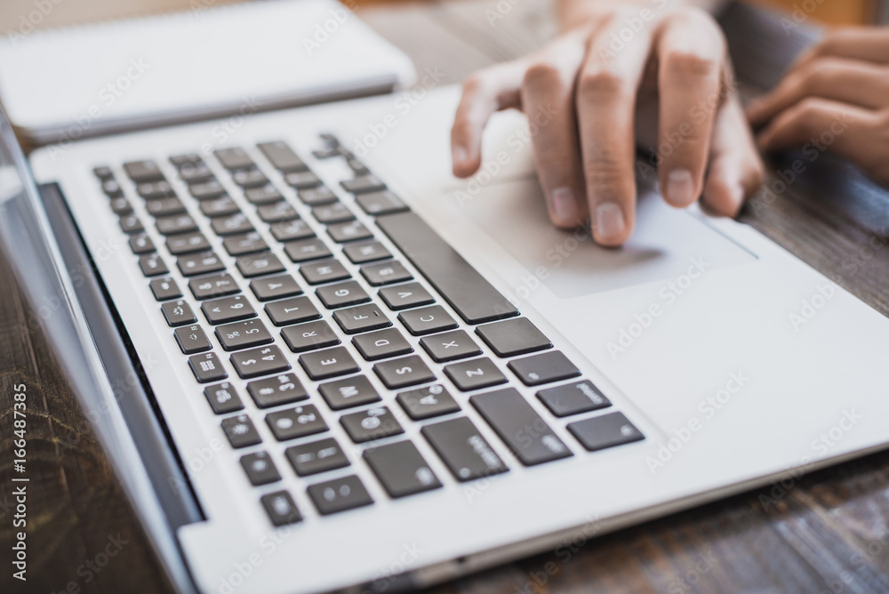 Morning business male. Male hands working on a laptop. Horizontal frame Morning business male. Male hands working on a laptop. Horizontal frame