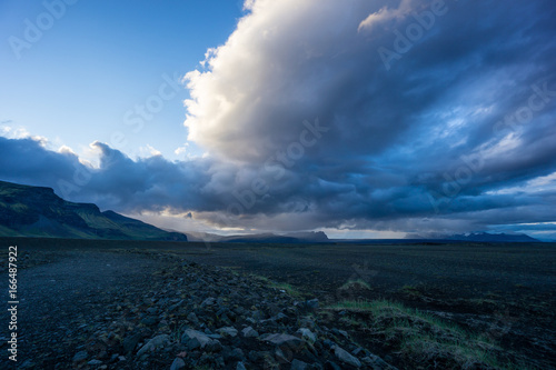 Iceland - Burning clouds at dawn over mountainous lava landscape