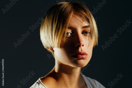 Beautiful blonde girl with short hairdo