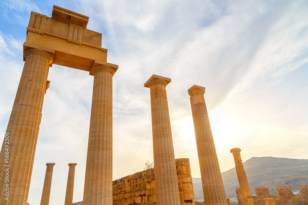Ruins of ancient temple in sunset. Lindos. Rhodes island. Greece Ruins of ancient temple in sunset. Lindos. Rhodes island. Greece
