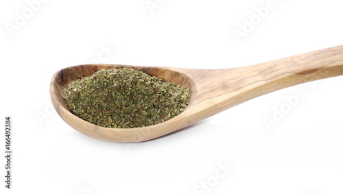 Dry marjoram in wooden spoon isolated on white background
